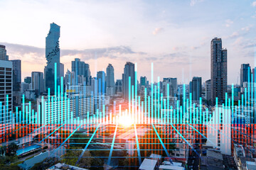 Fototapeta na wymiar Glowing FOREX graph hologram, aerial panoramic cityscape of Bangkok at sunset. Stock and bond trading in Asia. The concept of fund management. Double exposure.