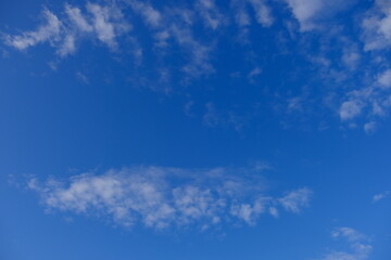Winter blue sky and soft white clouds
