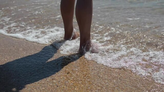 Sea water line wash woman feet – 4k video. 