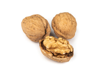 Walnuts and cut nut isolated over white background