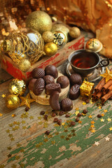 Coffee cup, chocolate candies, Christmas decor. Christmas and New Year Holiday concept. cozy home. winter festive season composition