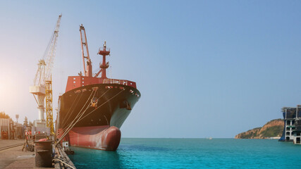 Cargo ship Moored and Mooring bollard with a fixed rope on the front of Bulbous bow ship Logistics...