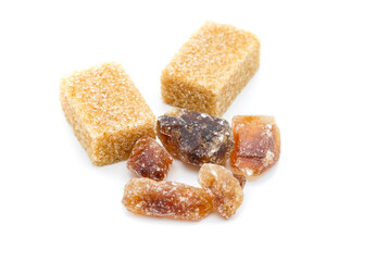 brown sugar and raw cubes isolated on white background