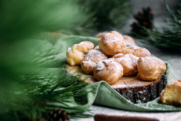Profiteroles with custard on the table. New Year's dessert