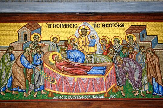 Beautiful mosaic showing the Dormition of the Virgin Mary outside of a Christian orthodox church - Athens, Greece, March 12 2020.