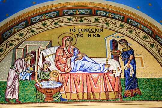 Beautiful mosaic showing the Nativity of Mary outside of a Christian orthodox church - Athens, Greece, March 12 2020.