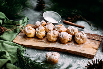 Profiteroles with custard on the table. New Year's dessert