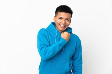 Young Ecuadorian man isolated on white background celebrating a victory