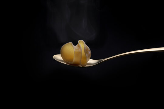 Galet on spoon. Spanish typical food for Christmas. Isolated on black background. Christmas food concept
