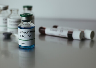 coronavirus covid-19 vaccine in vaccine bottle, doctor in the laboratory with a biological tube...