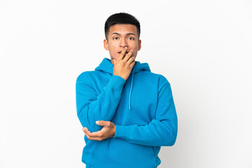 Young Ecuadorian man isolated on white background surprised and shocked while looking right