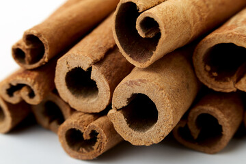 Cinnamon close up on a white background