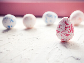 Close-Up Of Multi Colored Easter Eggs Against Wall