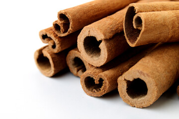 Cinnamon close up on a white background