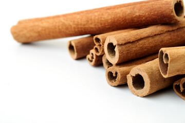 Cinnamon close up on a white background