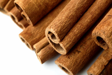 Cinnamon close up on a white background