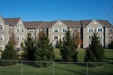 Apartment Complex with Evergreen Trees