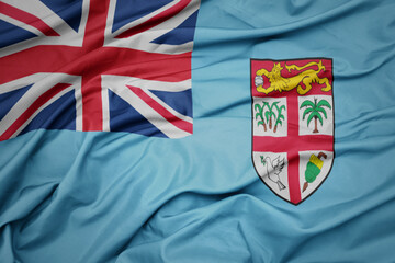 waving colorful national flag of Fiji .