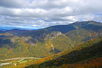 Franconia Notch with fall foliage and Highway I-93 aerial view from top of the Cannon Mountain in Franconia Notch State Park in White Mountain National Forest, near Lincoln, New Hampshire NH, USA. 
