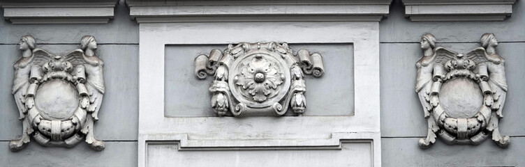 A bas-relief on the facade of a building with different subjects