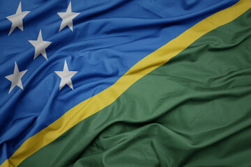waving colorful national flag of Solomon Islands .