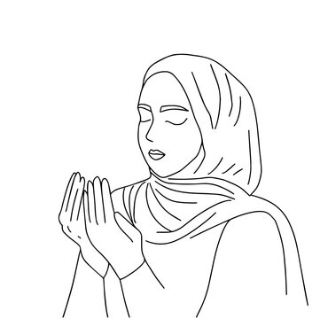 Muslim woman makes traditional prayer to God, keeps hands in praying gesture, wears traditional clothes in nijab, has serious facial expression, isolated over beige background