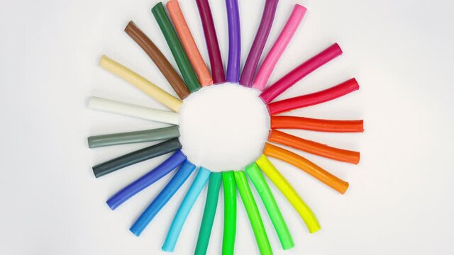 Stop motion of modeling clay pieces. Timelapse plasticine handmade background.  Rainbow set for children play.