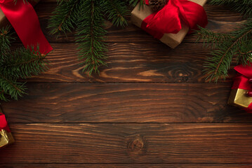 Christmas background with decorations and gift boxes on wooden table. Top view. Copy space.  Merry...
