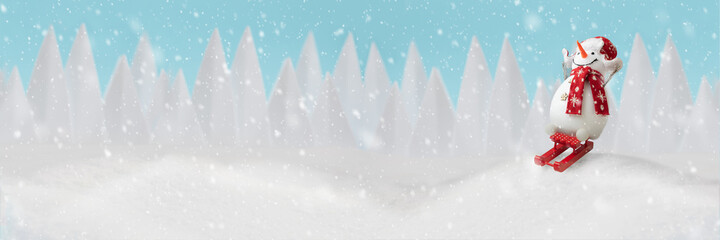Banner 3:1. Happy snowman sledding on sleigh in winter christmas landscape. Merry christmas and happy new year celebration