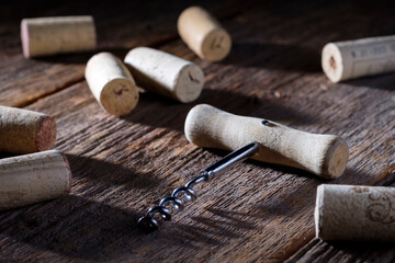 Fototapeta na wymiar Wine corks with corkscrew on wooden background. Celebrate. Party. Bar.