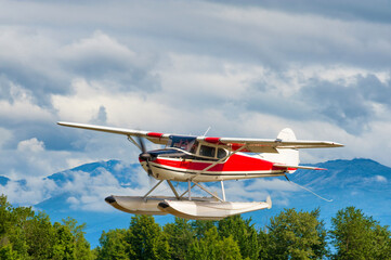 Seaplane gains altitude at Lake Hood Alakska