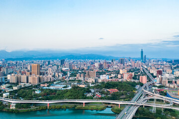 Fototapeta premium Taipei City Aerial View - Asia business concept image, panoramic modern cityscape building bird’s eye view under sunrise and morning blue bright sky, shot in Taipei, Taiwan