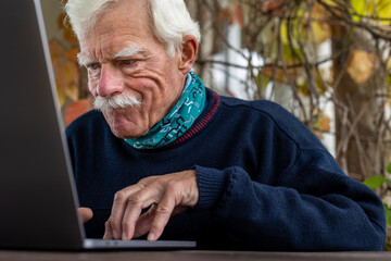 An old editor working hard on the next article using a modern