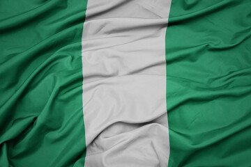Obraz premium waving colorful national flag of nigeria.
