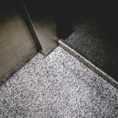 Beautiful white spotted stone floor in elevator