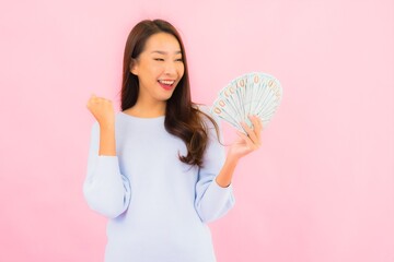 Portrait beautiful young asian woman with a lot of cash and money