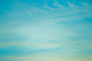 Obraz na płótnie Canvas Beautiful twilight blue sunset sky in soft and smooth white clouds with blue sky background