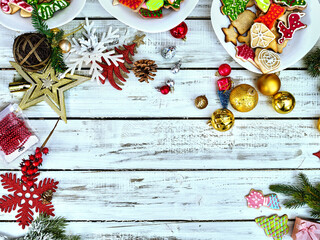 Christmas food background with cookies on copy space. Holiday above Xmas dessert on white wood top view.