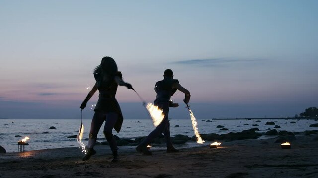 Fire dancers performing and juggling with fire