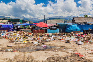 KARAKOL, KYRGYZSTAN - JULY 18, 2018: Rubish grounds at the bazaar in Karakol, Kyrgyzstan