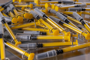 Large group of vaccine syringes