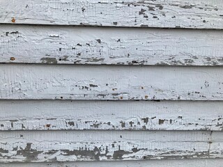 Peeling paint on old wood house