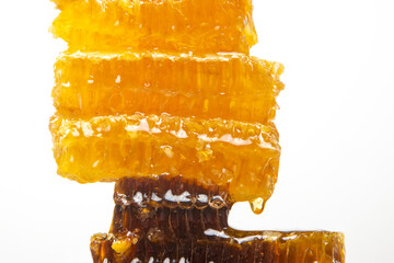 pieces of beeswax honey on a white background