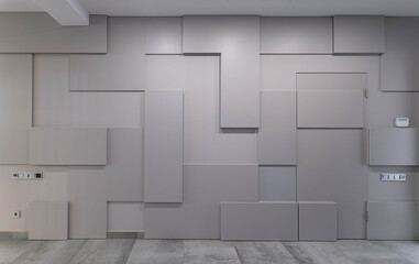 Contemporary interior of luxury apartment. Modern hi-tech geometric design of wall.