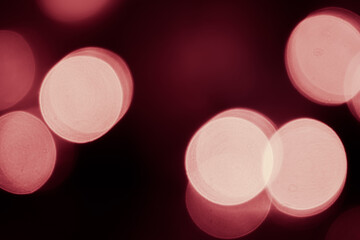 Pink bokeh is used as a background in Christmas. Valentine, New Year and other festivals