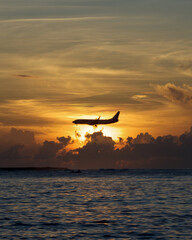 Fototapeta na wymiar airplane at sunrise