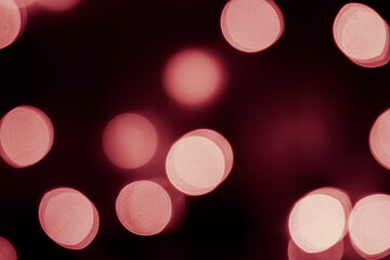 Pink bokeh is used as a background in Christmas. Valentine, New Year and other festivals