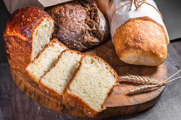 Various rustic bread on a wooden board. Healthy food and farming concept