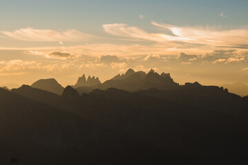 Beautiful scenic views of rocks and shadows at sunset in the Dolomites. Gorgeous stunning mountains in the golden hour. Italy