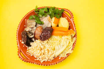 typical portuguese dish cozido a portuguesa on ceramic dish